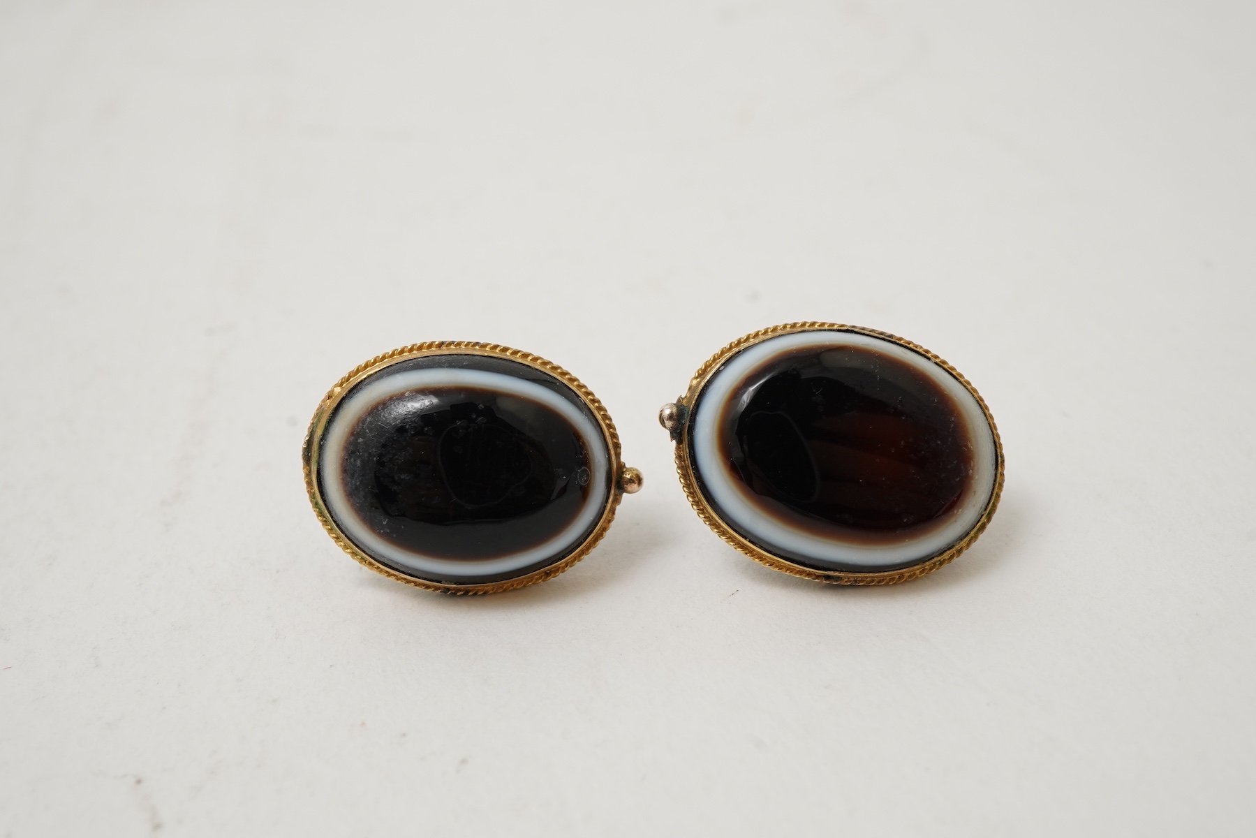 An onyx dress ring and pair of earrings